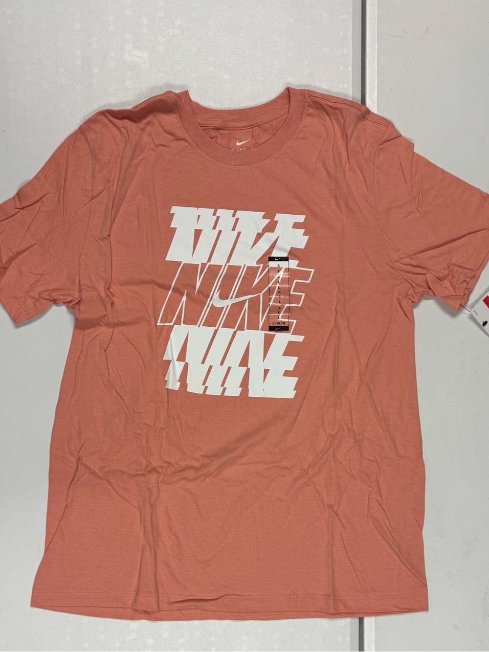 Nike Men’s Coral Graphic Repeat Logo Short Sleeve Tee